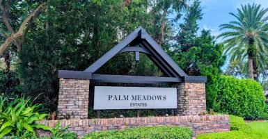 Palm Meadows Estates entry sign in West Boynton Beach, Florida.